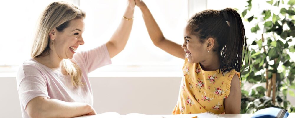 mother-help-girl-doing-homework-at-home